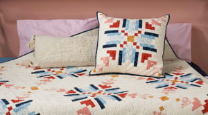 Knit-inspired snowflake quilt and cushion duo